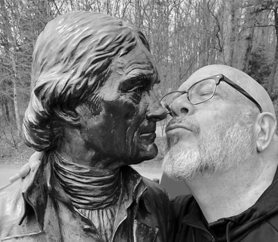 Ed Woodham, Founder and Director of Art in Odd Places, posing with the Thomas Jefferson statue at Monticello |photo by Sarah Ellis
